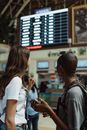 Man in White Polo Shirt and Black Backpack