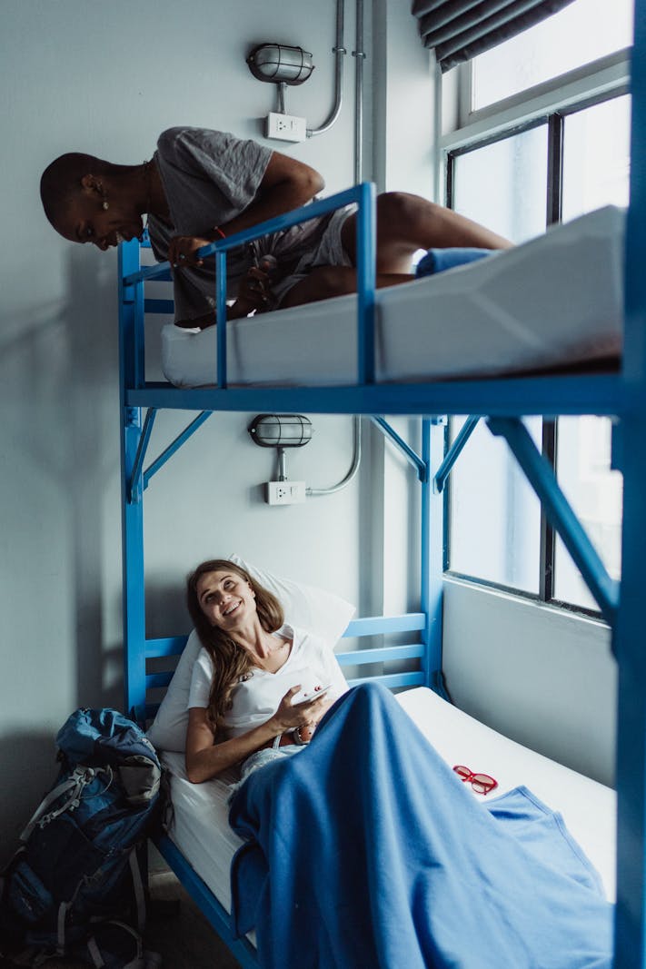 Cozy hostel bunk bed with privacy curtain