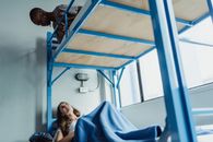 Women Talking while Lying on a Bunk Bed 