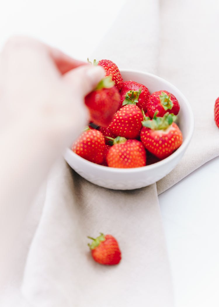 Strawberries In Plate On White Surface