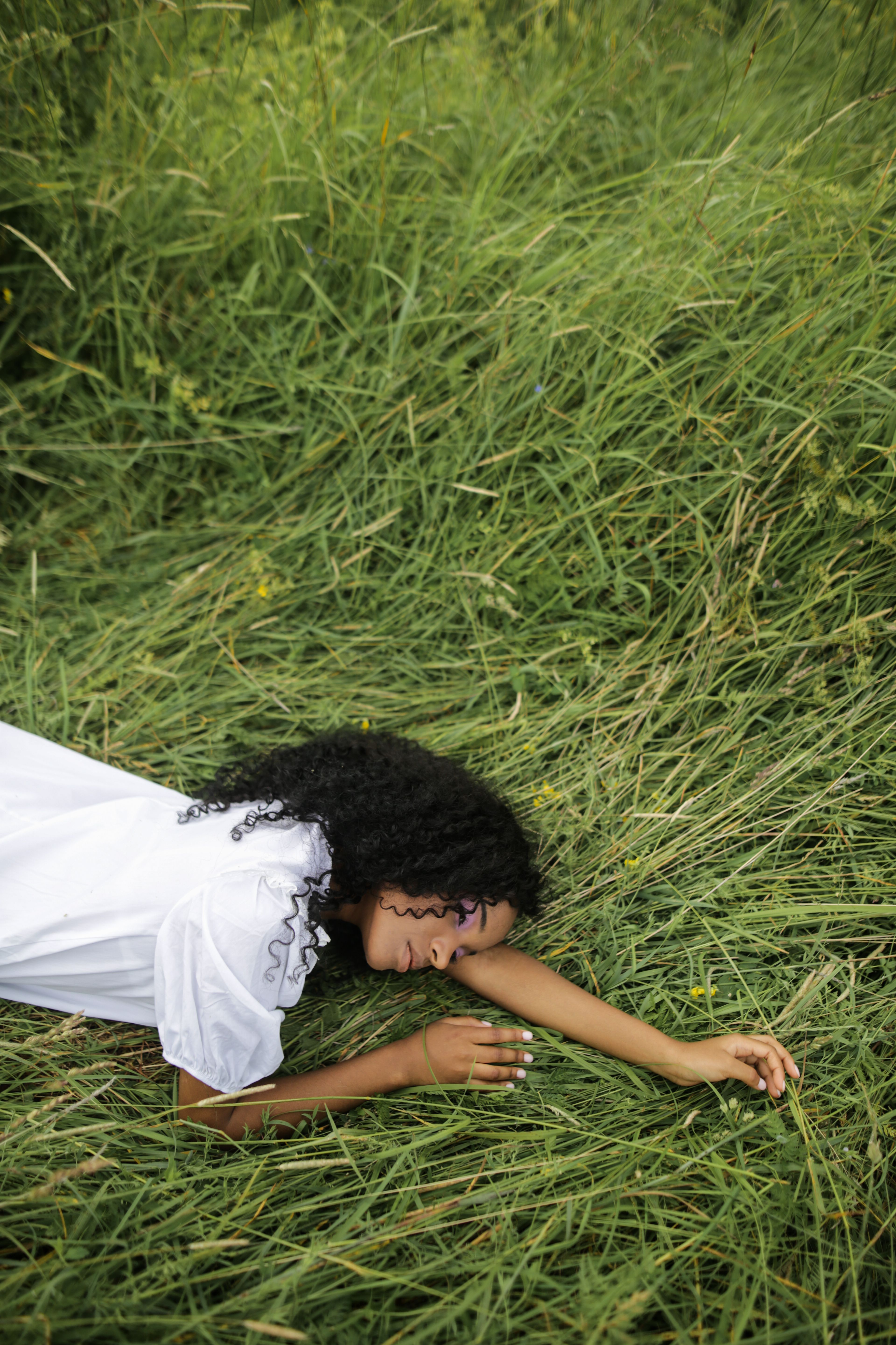 Woman in White Dress Lying on Green Grass · Free Stock Photo
