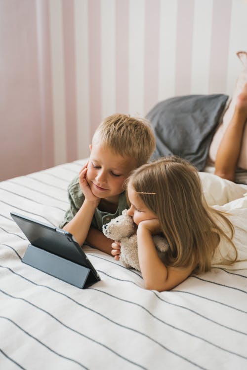 Girl and Boy on Bed