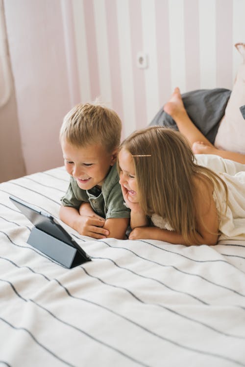 Girl and Boy on Bed