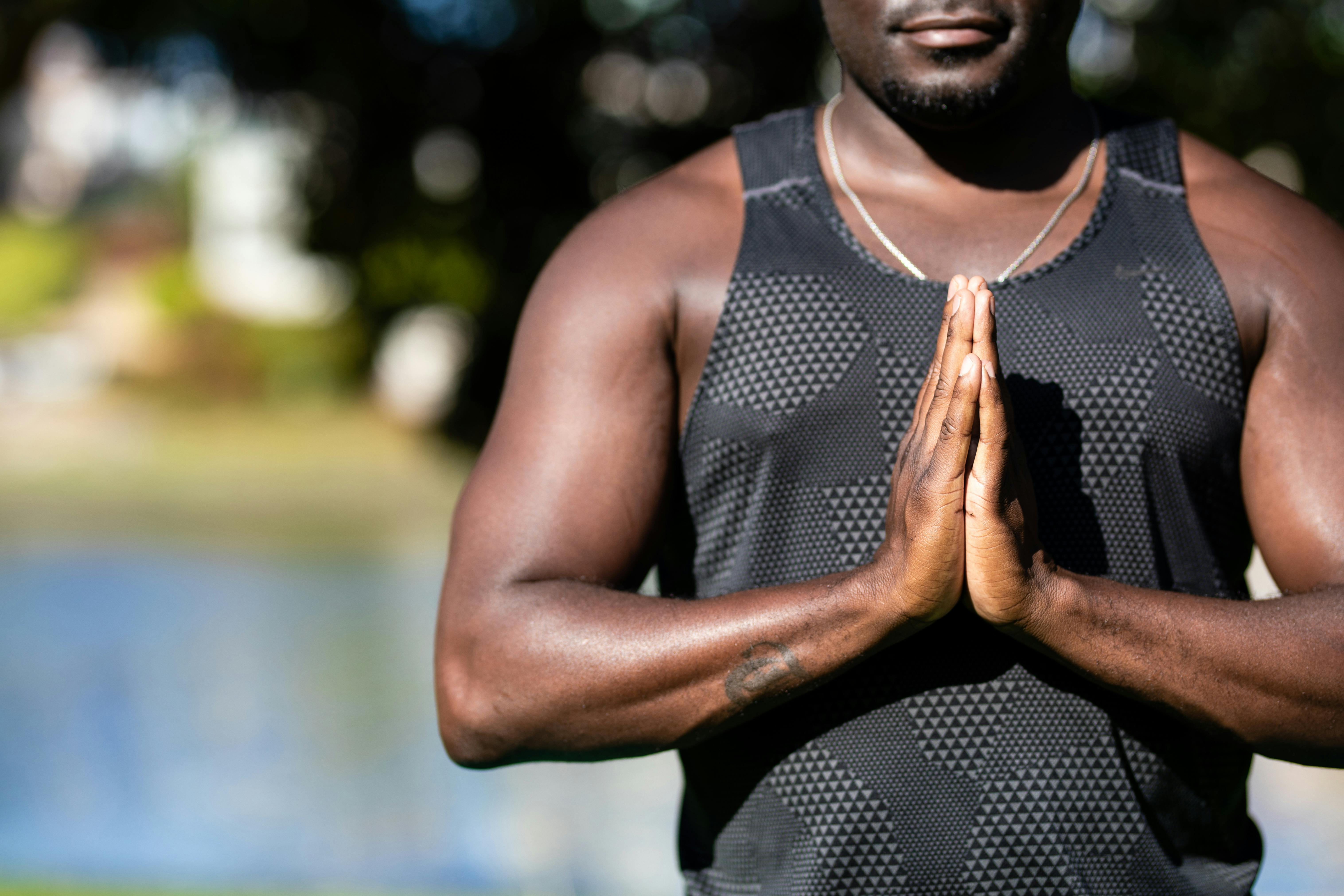 close up photo of a man with his hands together