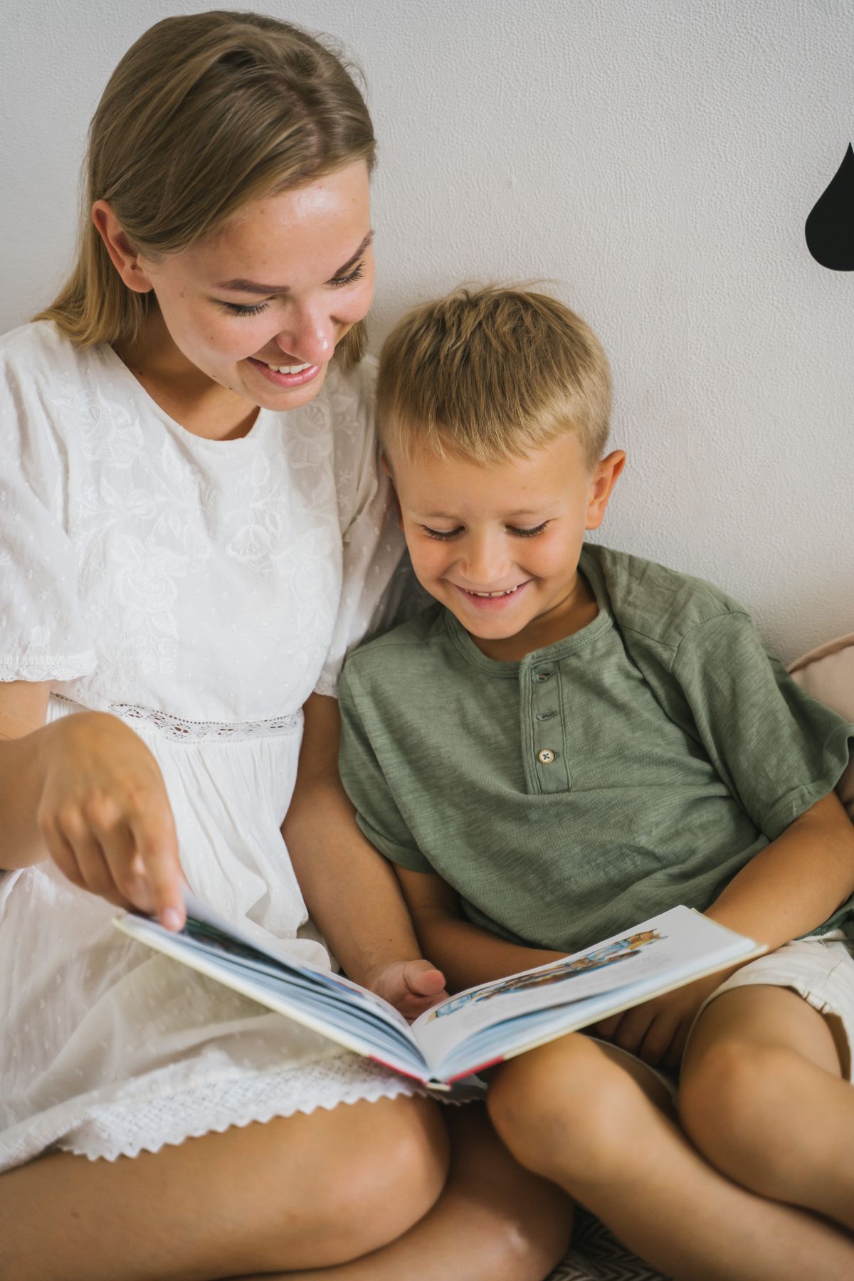 Mother reading a book with her son