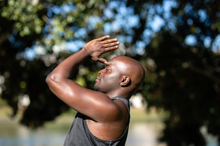 Close Up Photo Of A Bald Man Meditating