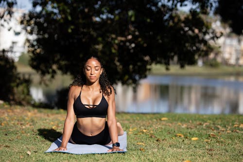 Woman in Black Sports Bra Doing Yoga
