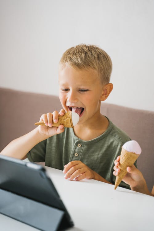 Free Photo of a Boy Eating Ice Cream Stock Photo