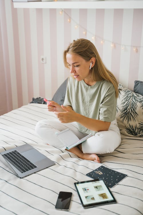 Person Sitting on bed While on a Video Call