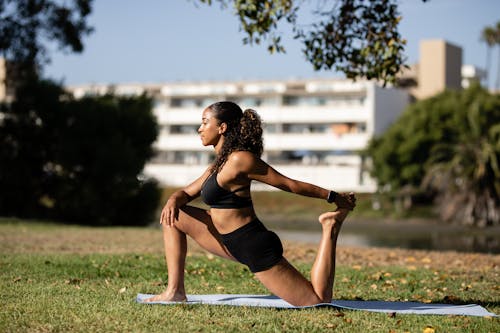 Woman Exercising on Yoga Mat