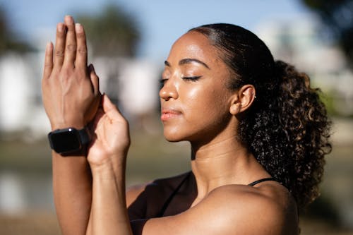 Person Meditating in Close Up Photography