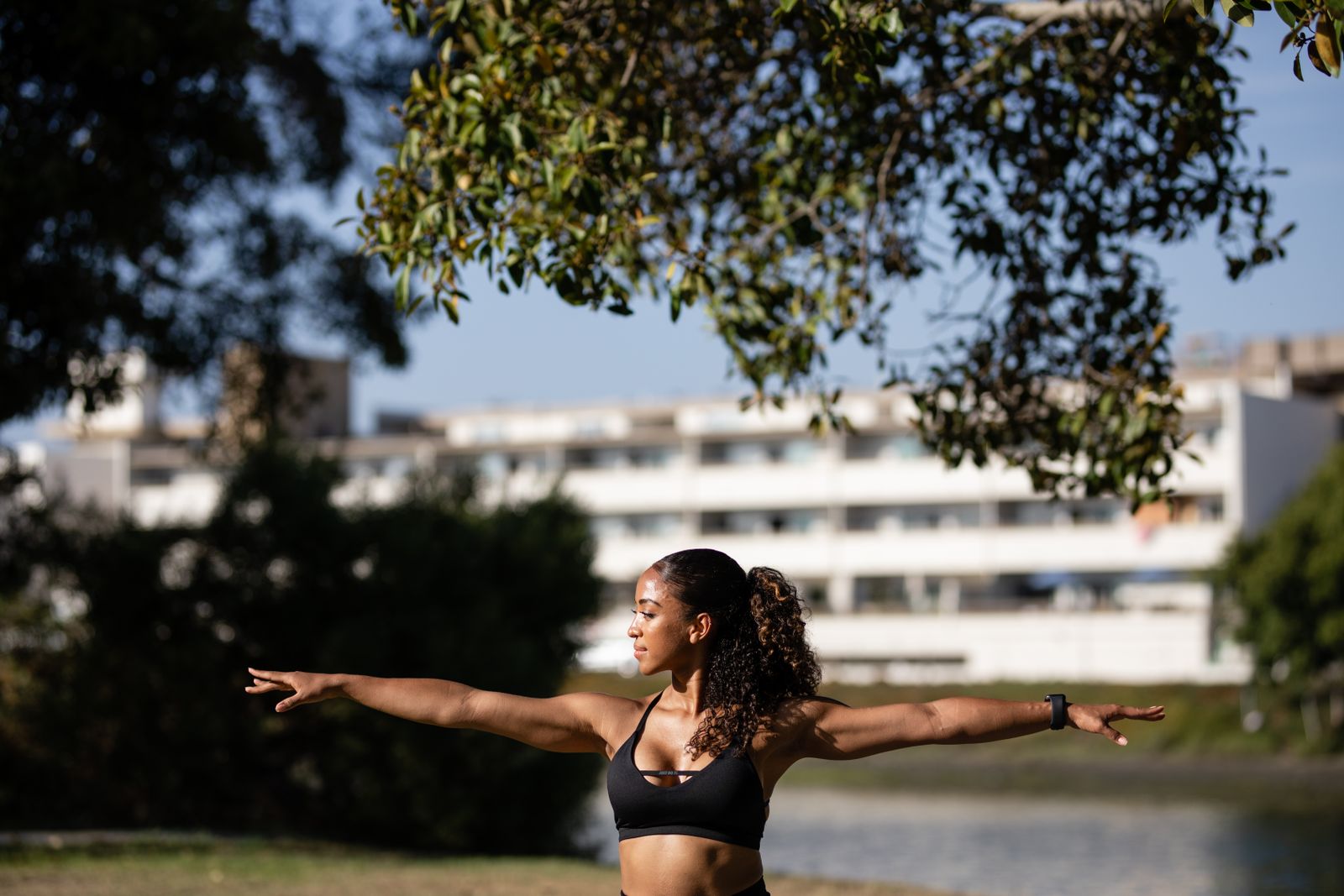 Woman wearing black yoga activewear outdoors