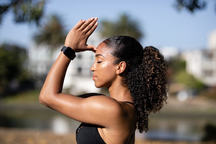 Woman Wearing Black Smartwatch Meditating