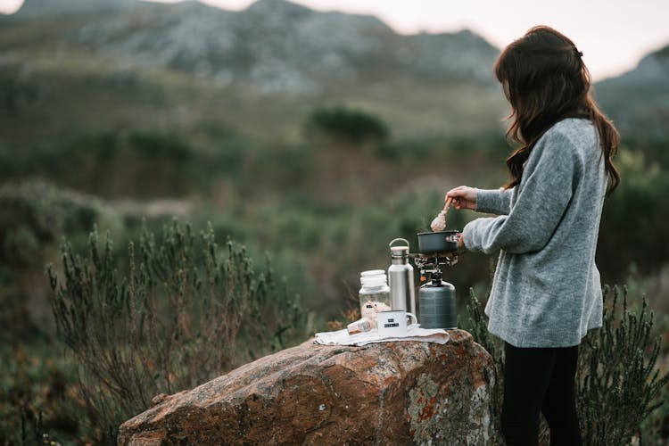 A Woman Cooking Oatmeal