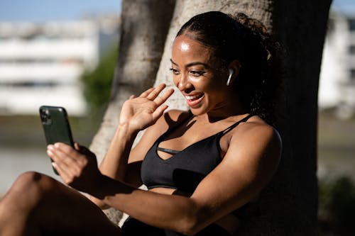Free Woman in Black Sports Bra on a Video Call Stock Photo