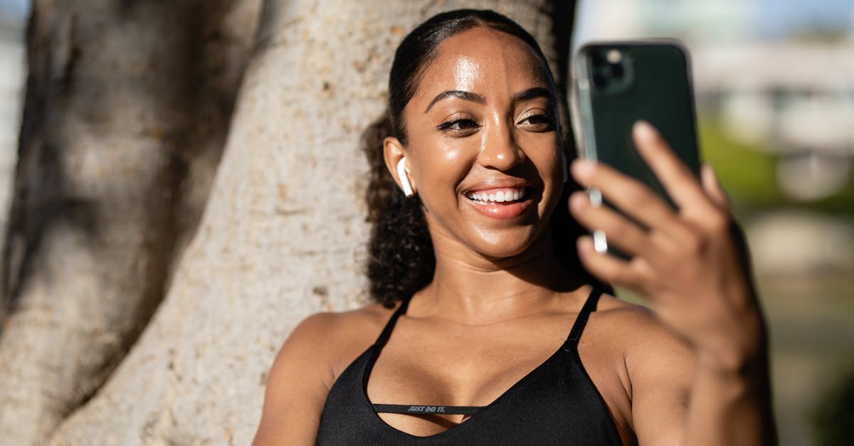 Woman looking in the mirror and smiling confidently.
