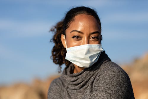 A Woman Posing in a Face Mask