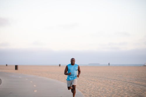 Free Man in Blue Top Running Stock Photo