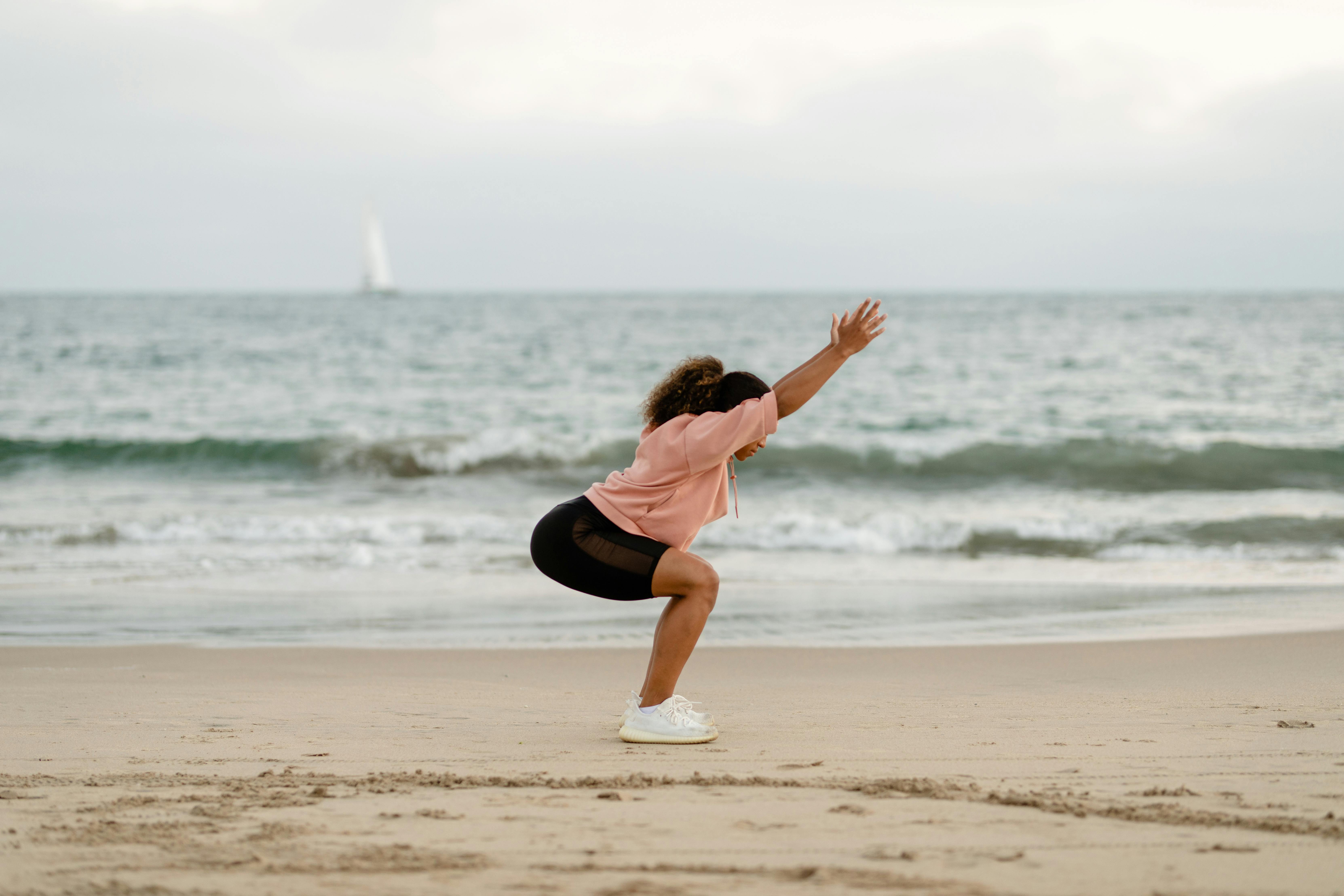 Pregnant Woman On Beach Doing Yoga Stock Photo 643124266