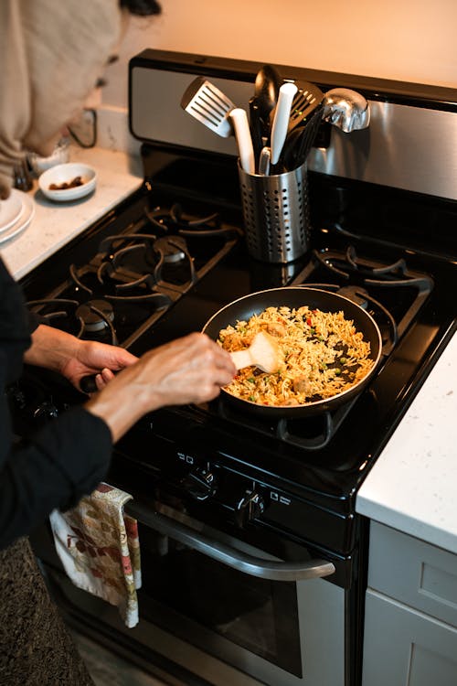 A Woman Cooking Fried Rice