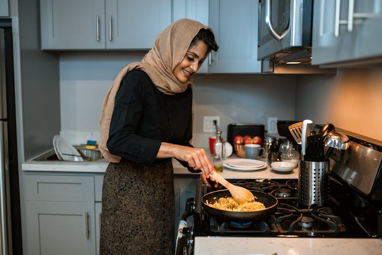 A Woman Cooking Fried Rice