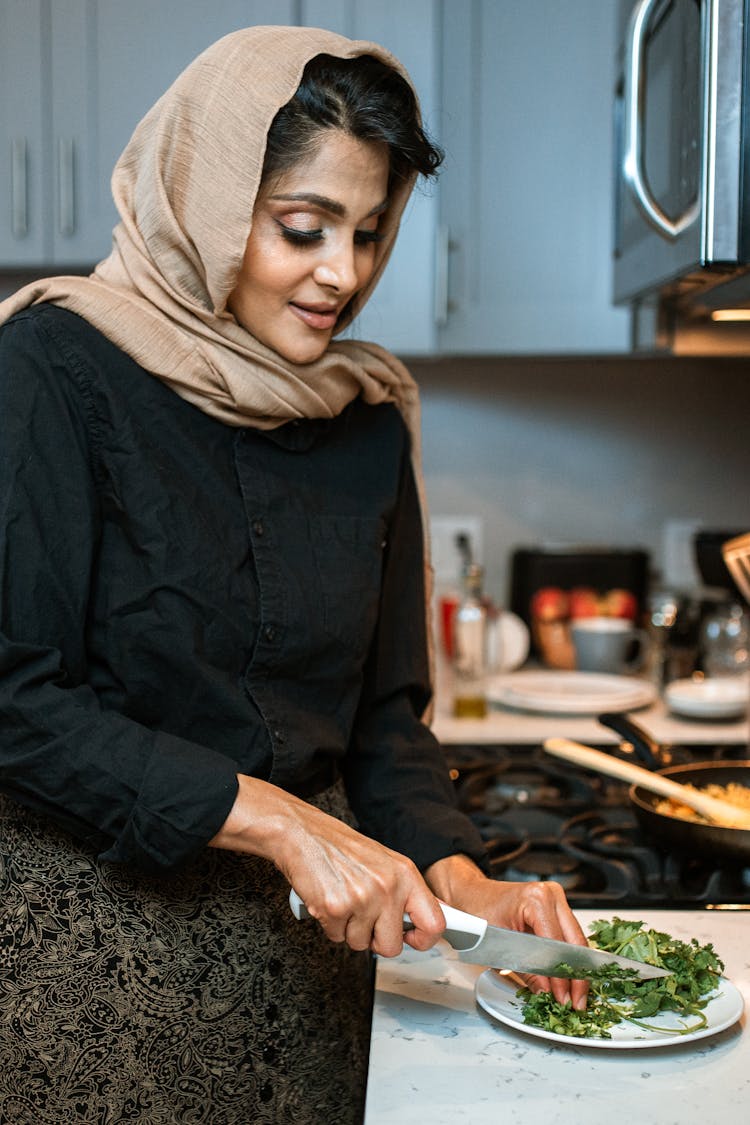 A Woman Chopping Parsley