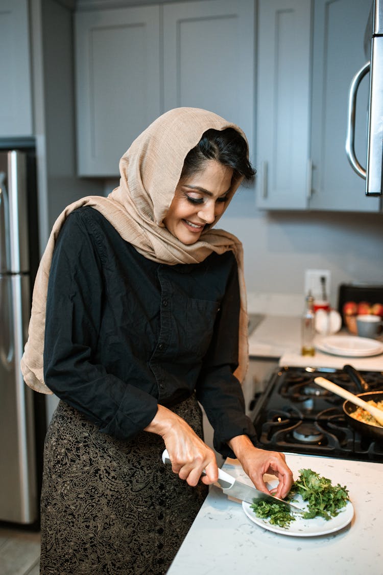 A Woman Chopping Fresh Parsley