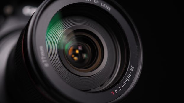 Detailed close-up of a camera lens showcasing sharp elements and reflections.