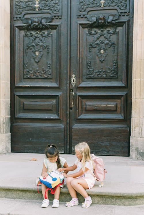 Girls Sitting on a Stair