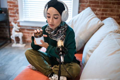 Woman in White headphones doing a Vlog 