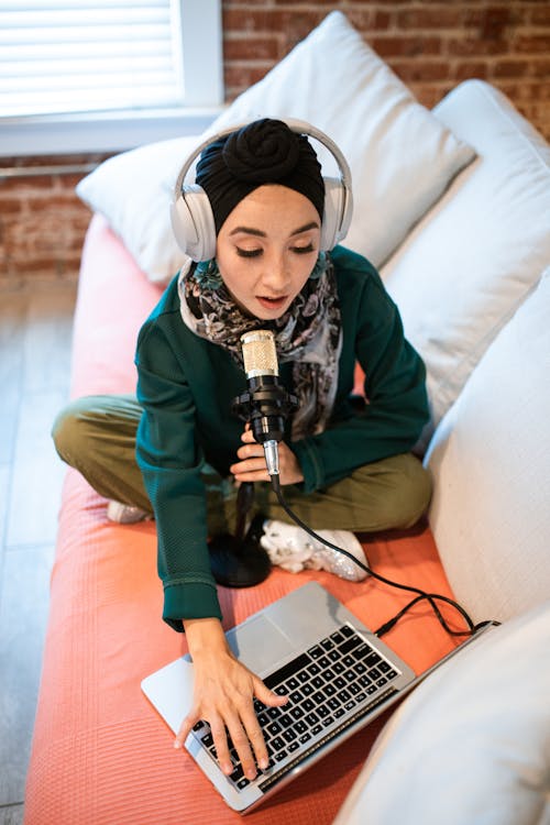 Woman doing recording on Couch 