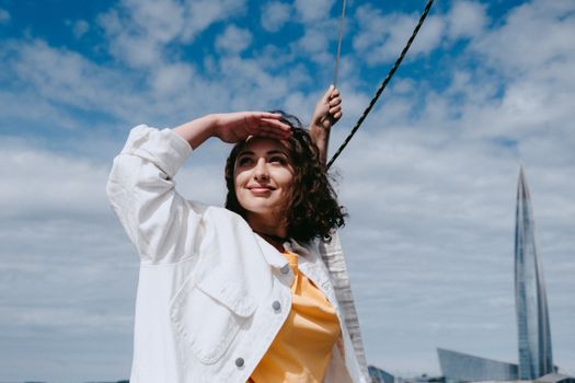 Woman in White Coat Holding Her Hair