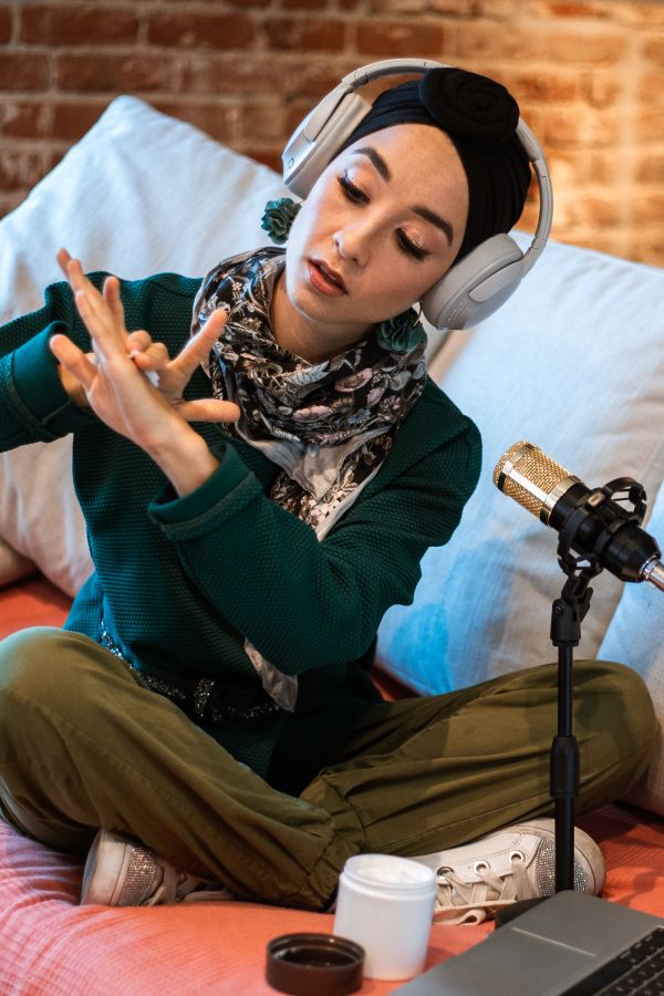 Host in headphones recording with a condenser microphone — photo by RDNE Stock project on Pexels