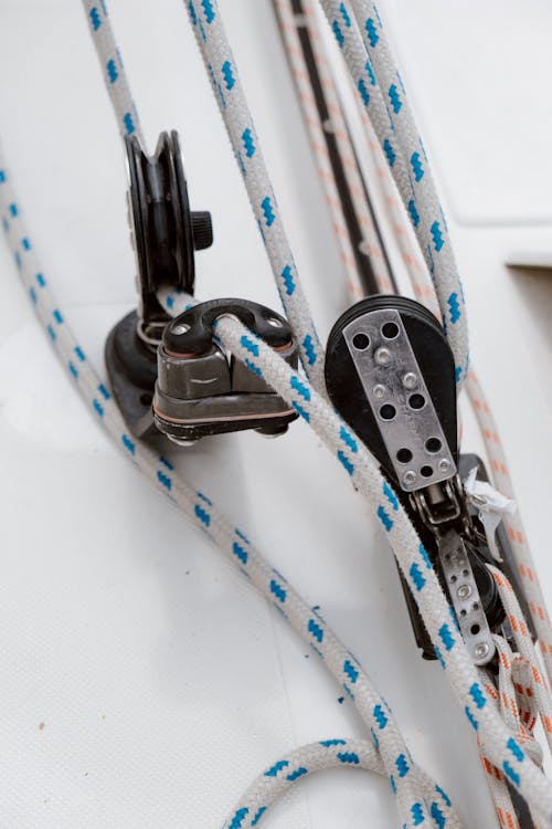 Blue and White Lanyard on White Table