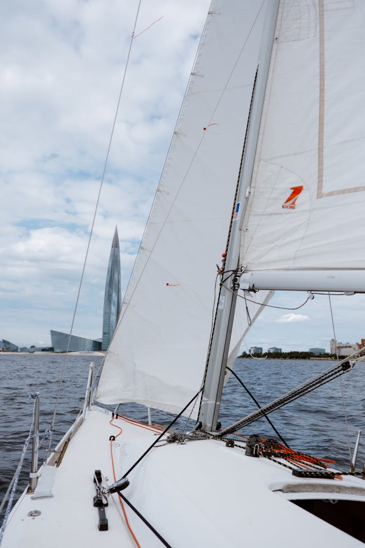 White Sail Boat On Sea