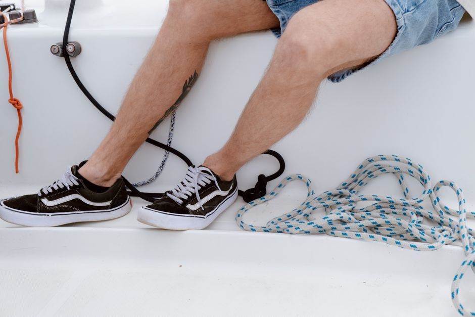 Incredible Private Yacht Rental 37Ft in Miami Up to 12 People Review: Your Complete Guide to Miami's Best Value Yacht Experience Review 2026 - Close-up view of a person sitting on a yacht deck with nautical ropes, showcasing a casual sailing vibe.