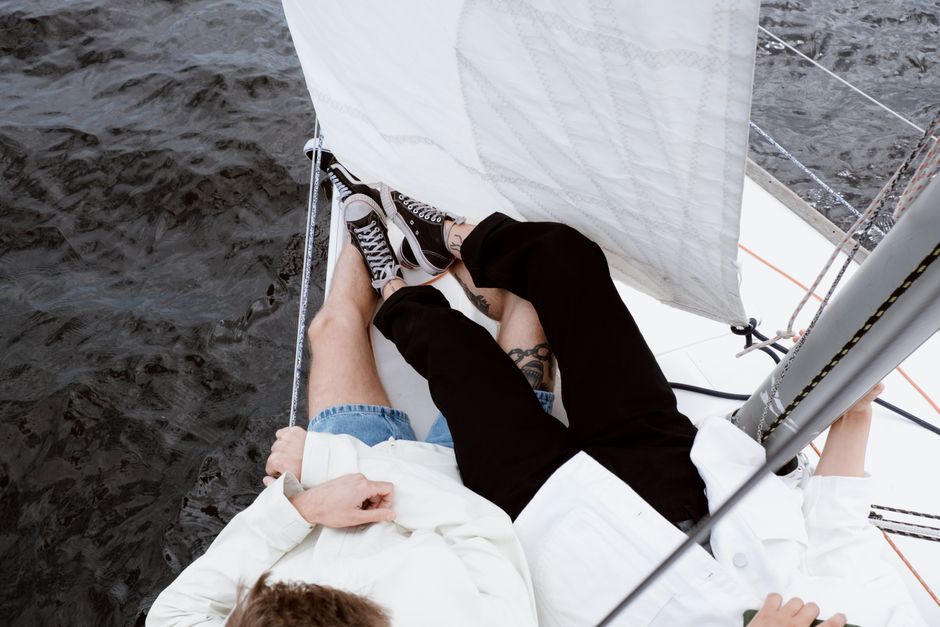 Outstanding Full Day Sport Fishing Charter Honolulu Review: 8 Hours of Luxury Fishing on Oahu's Waters Review 2026 - A couple enjoys a leisurely day on a sailboat, embracing the adventure of sailing together.