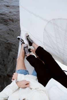 A couple enjoying a peaceful sailing trip, capturing leisure and romance.
