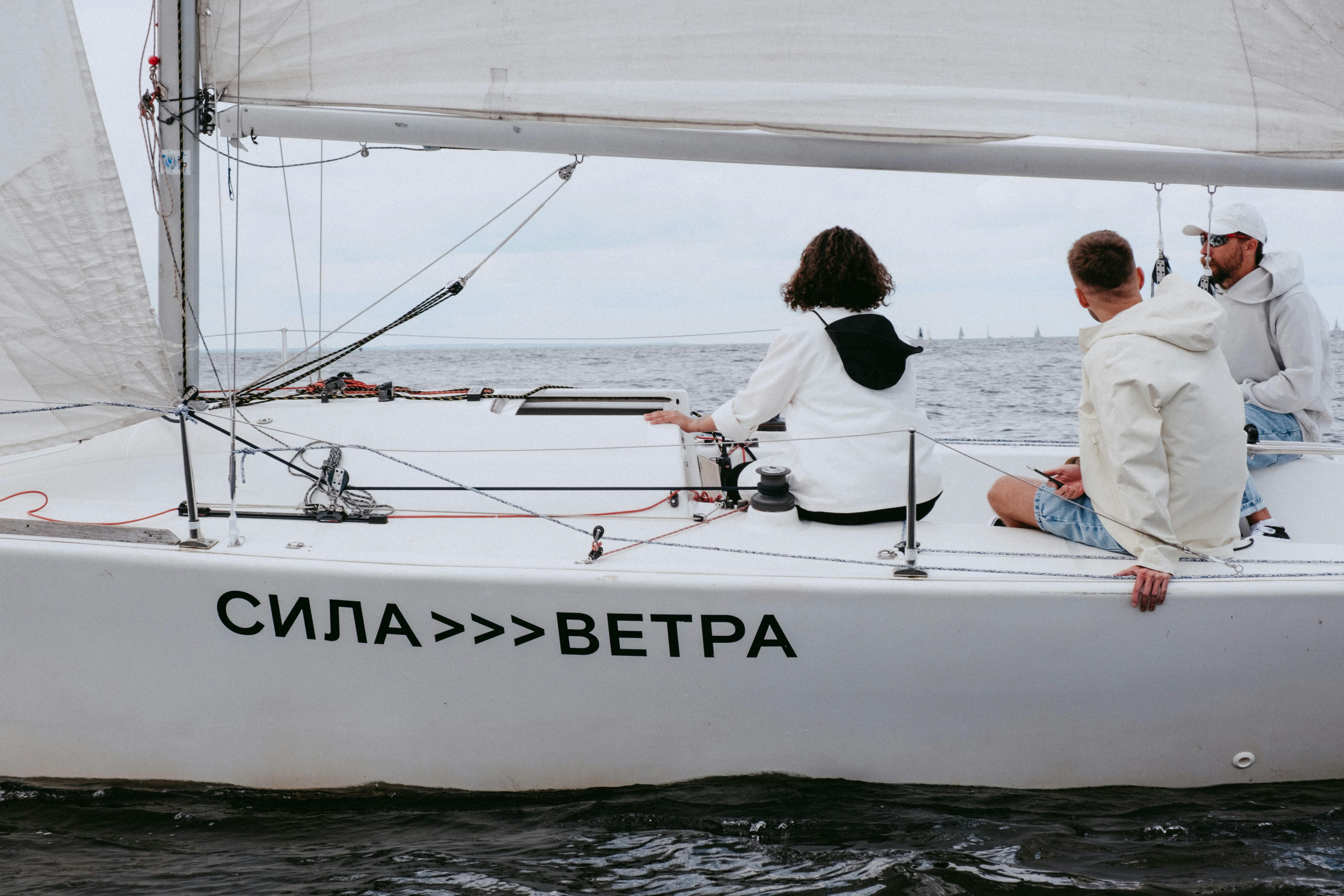 man and woman in white boat on sea