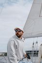 Man in White Hoodie Wearing Black Sunglasses