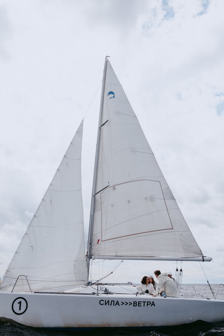 White Sail Boat On Water