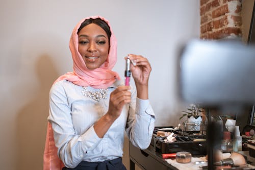 Free Female Vlogger in Pink Hijab doing a Video Vlog Stock Photo
