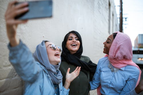 Free Women Wearing Hijabs Taking Selfie Stock Photo