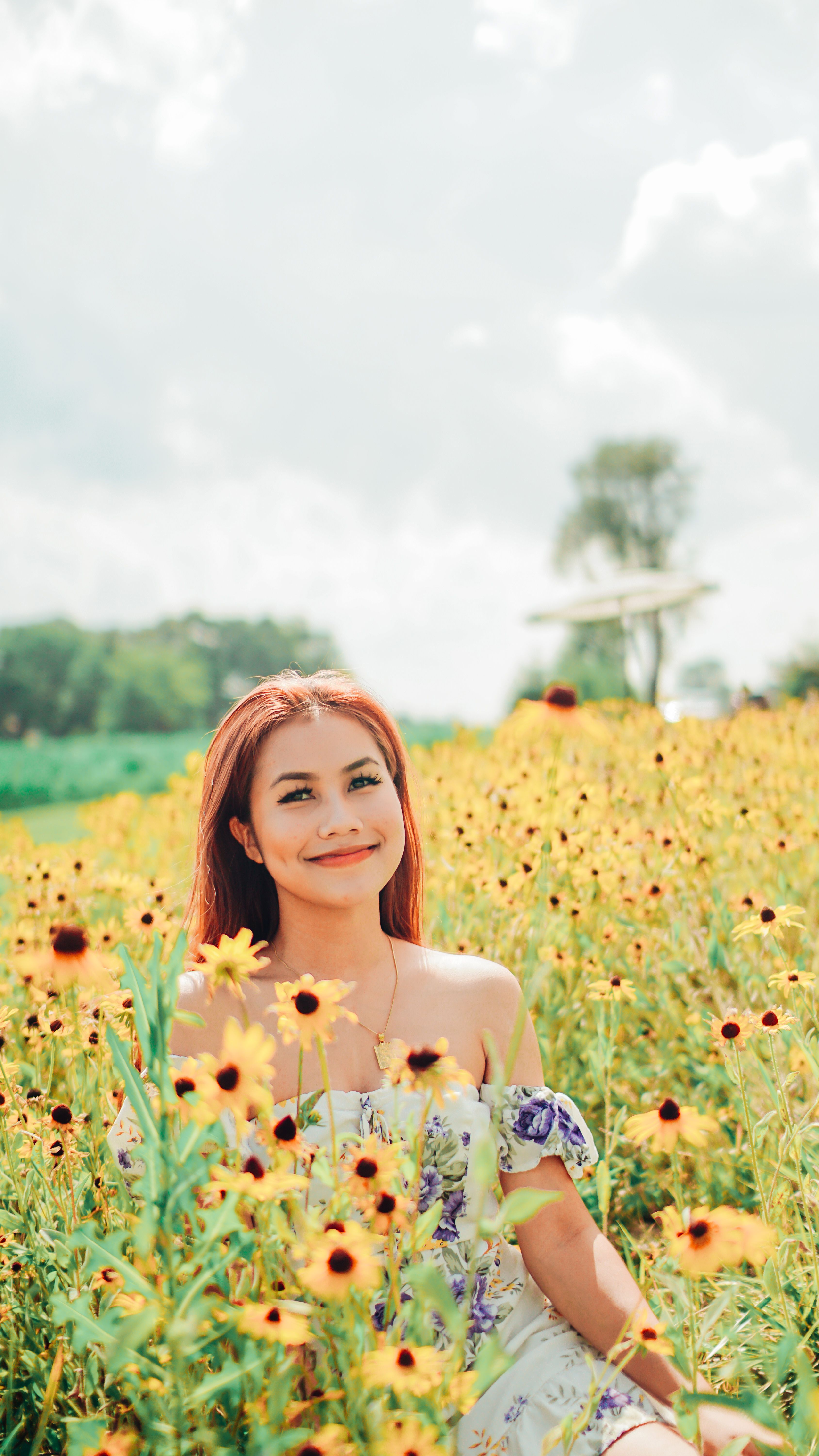 Woman Standing on Sunflower Field · Free Stock Photo