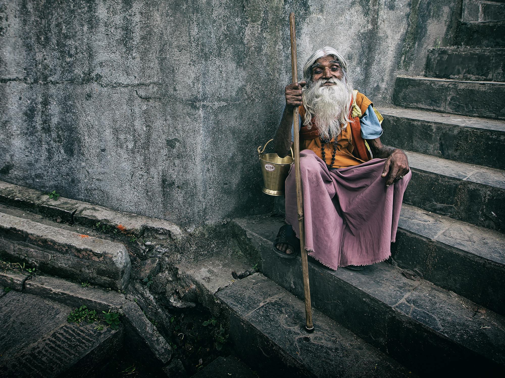 Hindu Saint Photo by Mehmet Turgut  Kirkgoz  from Pexels: https://www.pexels.com/photo/senior-ethnic-man-in-traditional-wear-sitting-on-steps-4912651/