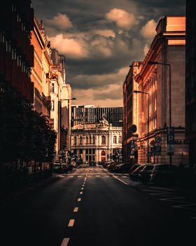 Capture of Warsaw's vibrant downtown with striking architecture and moody clouds.