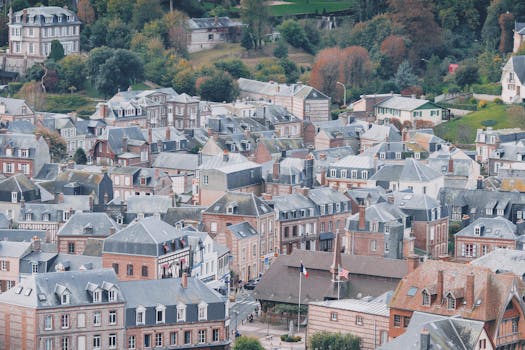 Aerial shot showcasing quaint rooftops and architecture of a European town, embracing elegance and history.