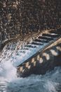 Water crashing on stone wall