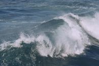 Stormy ocean with splashing foamy water stream