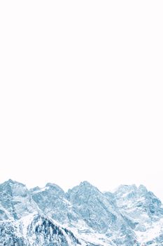 Picturesque view of bristly ridge with pointed peaks covered with snow in winter in daylight